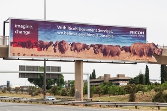 Ricoh SA advertising campaign billboard based on rhino poaching and preservation.